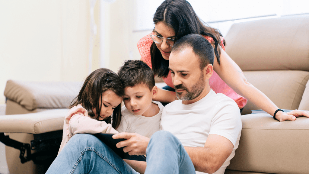 Family of 4 watching Celebrated audio visual tribute on their computer